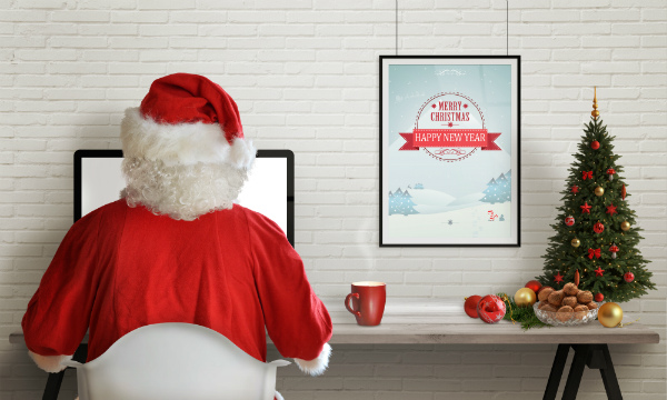 santa-on-computer-planning-christmas-shipping-strategy-